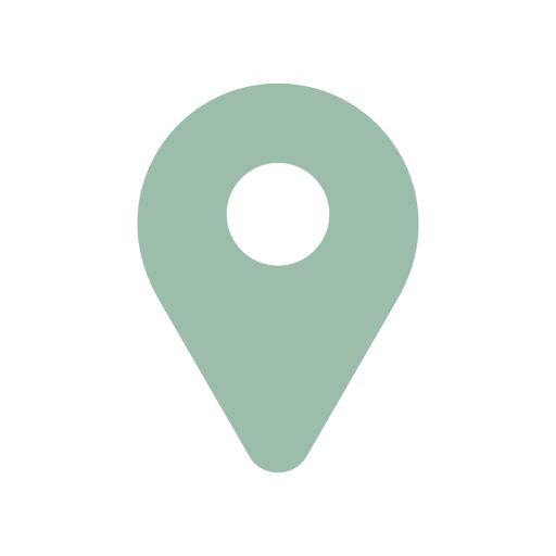 A green map pin icon on a white background.