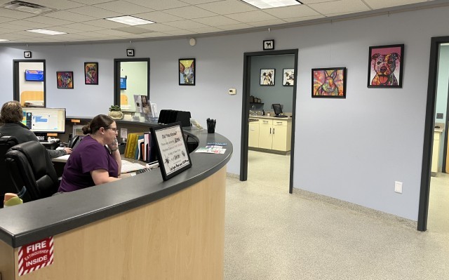 A veterinary reception with people working to provide better care for the animals.